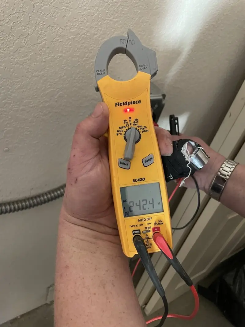 Voltage testing with clamp meter during Ceiling Fan Installation in Wallace